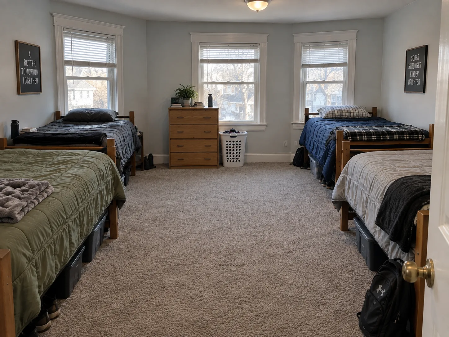 Large shared room arranged with four Twin XL beds